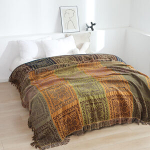 Cotton jacquard throw blanket draped over a bed