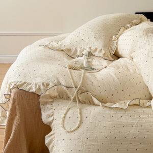 Black dot duvet cover set with ruffled edges, soft and cozy for kids’ rooms.
