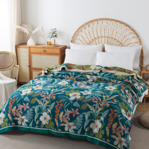 Botanical floral throw blanket displayed on bed