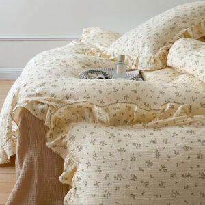 Olive print cotton duvet cover set on bed with ruffled pillowcases