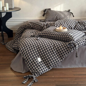 cotton gingham bedding set includes a matching patterned pillowcase. A charming bow tie adorns the edge of the duvet cover and pillowcase.