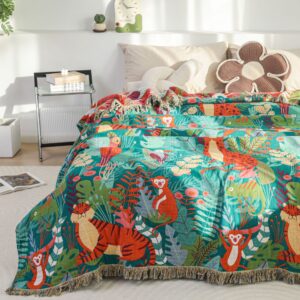 Cotton jacquard jungle animal throw blanket on bed