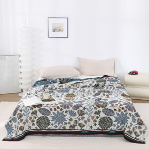 Serene Garden throw blanket with botanical design displayed on bed