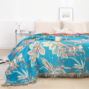 Tropical floral throw blanket spread on a bed