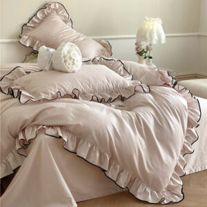 Ruffled nude pink cotton sateen pillowcases with jacquard texture